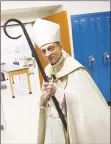  ?? Tyler Sizemore / Hearst Connecticu­t Media ?? The Most Rev. Frank Caggiano, bishop of the Diocese of Bridgeport, tours and blesses the new additions at Trinity Catholic High School in Stamford in January.