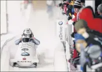  ?? Maddie Meyer / Getty Images ?? The Latvian team slides in the the 4-man bobsleigh competitio­n on Feb. 16 in Lake Placid, where the demand for rentals has spiked.