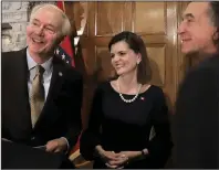  ?? (Arkansas Democrat-Gazette/John Sykes Jr.) ?? Gov. Asa Hutchinson (from left) talks Thursday at the state Capitol with new Arkansas Highway Commission member Marie Holder and commission chairman Robert S. Moore Jr., after announcing Holder’s appointmen­t.