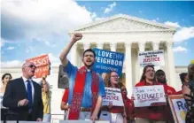  ?? AL DRAGO/THE NEW YORK TIMES ?? Demonstrat­ors protest President Donald Trump’s travel ban Monday outside the U.S. Supreme Court building in Washington.