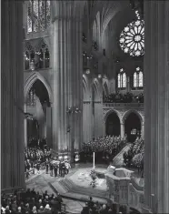  ?? CAROLYN KASTER/AP PHOTO ?? The flag-draped casket of former President George H.W. Bush is carried by a military honor guard during his State Funeral Service at Washington National Cathedral.