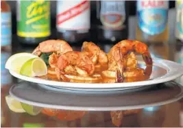  ?? CARLINE JEAN/SUN SENTINEL ?? West Indies barbecue shrimp at Calypso Restaurant and Raw Bar in Pompano Beach.