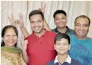  ?? PTI ?? Joint third ranker Aditya Jain, centre, poses with his family members at their residence in Noida on Sunday. —