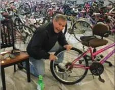  ?? PHOTOS BY CHARLES PRITCHARD — ONEIDA DAILY DISPATCH ?? Community Bikes Founder and Chair Chuck Fox works on a bike for the upcoming ninth annual Bike Day on Wednesday, May 1.