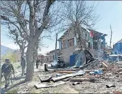  ??  ?? Forces outside the house where the encounter took place at Kakapora village in Pulwama on Friday.