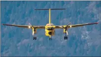  ?? The Canadian Press ?? A Canadian Forces CC-115 Buffalo aircraft prepares to land at the airport in Chilliwack.