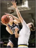  ??  ?? Connecticu­t’s Katie Lou Samuelson (left), goes up for a shot with pressure from Notre Dame’s Jessica Shepard during the first half of an NCAA college basketball gameon Dec 2 in South Bend, Indiana. (AP)