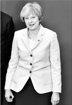  ??  ?? May poses for a family picture at the Eastern Partnershi­p summit at the European Council Headquarte­rs in Brussels. — Reuters photo