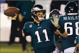  ?? RICH SCHULTZ — THE ASSOCIATED PRESS, FILE ?? The Eagles’ Carson Wentz, above during a Nov. 30 game against the Seahawks in Philadelph­ia, was traded on Thursday to the Colts, according to a source.