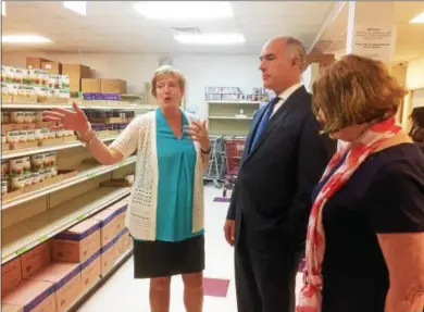  ?? EVAN BRANDT — DIGITAL FIRST MEDIA ?? Barbara Wilhelmy, left, executive director of the Cluster Outreach Food Pantry in Pottstown, gives U.S. Sen. Bob Casey a tour of the facility before he departed for Washington, D.C., to vote on the Senate’s farm bill.