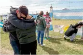  ?? — AFP ?? Relatives of crew member express their grief outside Argentina’s Navy base in Mar del Plata, on the Atlantic coast south of Buenos Aires, on Friday.