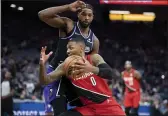  ?? JOSE LUIS VILLEGAS — THE ASSOCIATED PRESS ?? Portland Trail Blazers guard Damian Lillard (0) drives past Sacramento Kings center Tristan Thompson (13) during the first quarter of an NBA basketball game in Sacramento Wednesday.