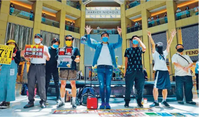  ?? Associated Presss ?? ↑
Protesters gather at a shopping mall during a pro-democracy rally against Beijing’s national security law in Hong Kong, on Tuesday.