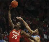  ?? (AP/The Roanoke (Va.) Times/Matt Gentry) ?? Virginia Tech’s Justyn Mutts (left) goes to the basket as North Carolina’s Pete Nance defends during Sunday’s Atlantic Coast Conference game in Blacksburg, Va. Mutts scored 27 points in the Hokies’ 80-72 win over the No. 18 Tar Heels.