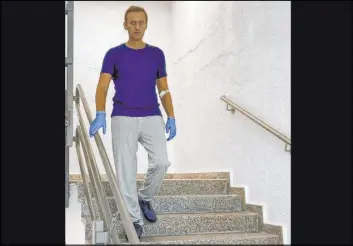  ?? The Associated Press ?? In this photo taken from a video published by Russian opposition leader Alexei Navalny on his Instagram account, Navalny shows the progress he has made at the German hospital that is treating him for Novichok poisoning.