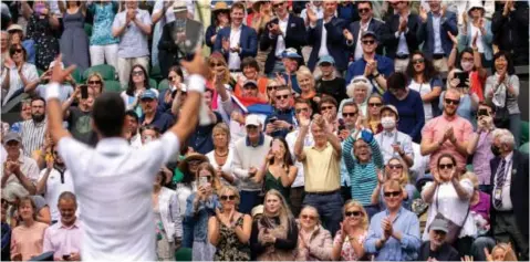  ?? AFP ?? SERBIA’S Novak Djokovic celebrates with the crowd after beating Chile’s Cristian Garin during their Wimbledon fourth-round match at The All England Tennis Club yesterday. For a full update on all yesterday’s action, visit www.iol.co.za/sport. | BEN SOLOMON