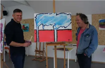  ??  ?? OPPOSITE: Brendan tries his hand at sketching after Mick shows him how to pick out a picture and frame it in his headLEFT: Brendan pictured with his finished painting, and artist Mick Mulcahy, who delivered the Artform course in Dunmore East