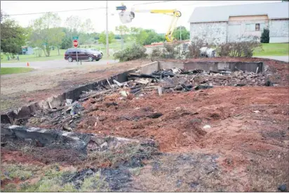  ?? BRIAN MCINNIS/THE GUARDIAN ?? Nothing remains of a vacant house in Mount Stewart that was destroyed in a fire that officials are calling arson. Crews from Bell Aliant were on the scene Tuesday evening repairing lines thet were melted from the heat of the fire. A resident of the...