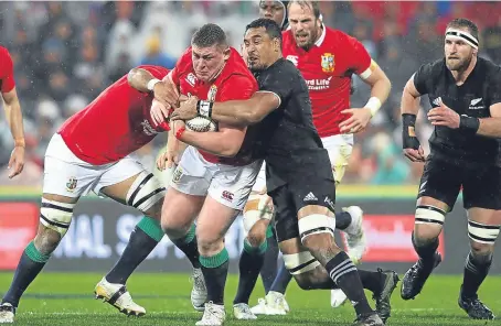  ??  ?? Tadhg Furlong is tackled by Jerome Kaino during the second Test match in Wellington last weekend.
