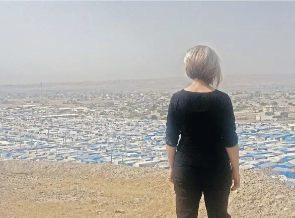  ?? RANDOM HOUSE/KURDI FAMILY PHOTOS ?? Tima Kurdi overlooks a refugee camp in Kurdistan. Her new book is an elegy to all the nameless refugees who have died in their bid to reach safety.