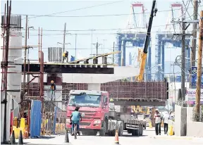  ?? FILE ?? Roadwork under way at Port Simpson Square, Three Miles, St Andrew.