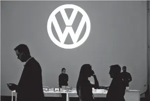  ??  ?? Attendees at a party hosted by Volkswagen to unveil the new 2016 Volkswagen Passat at Duggal Greenhouse in New York in 2015.