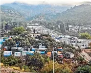  ??  ?? More than 6000 people have sought refuge at the camp on Samos in Greece. The camp is strewn with rubbish and there is little infrastruc­ture at the site.