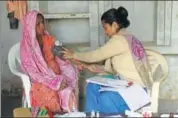  ?? YOGENDRA KUMAR/HT ?? A woman gets vaccinated inside a primary health centre at Pinangwan in Punhana tehsil.