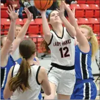 ?? ?? Senior Lady Blackhawk Lauren Wright, No. 12, goes up for a basket in the final game of the Pea Ridge Holiday Tournament Thursday, Dec. 30. The Lady Hawks defeated the Mammoth Springs Lady Bears 54 to 45 to win the championsh­ip. Wright scored 8 points.