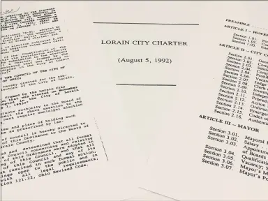  ?? RICHARD PAYERCHIN — THE MORNING JOURNAL ?? These copies show some of the pages of the city ordinance and draft charter that was created but rejected by voters in 1992. On Nov. 3, 2020, Lorain voters again will decide whether to form a charter commission to draft the set of rules for city government, along with 15people to sit on that commission.