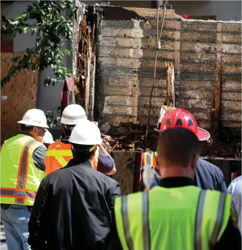  ??  ?? The floor section of the damaged balcony is laid on a flatbed truck in Berkeley, California