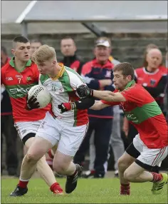  ??  ?? Kiltegan’s Steven Coogan is caught by Rathnew’s Chris Murphy during the JBFC semi-final in Pearse’s Park, Arklow. Picture: Garry O’Neill