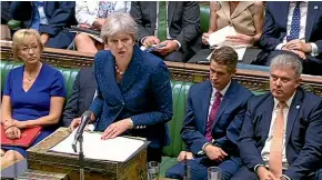  ?? AP ?? A beleaguere­d Prime Minister Theresa May gives a statement to parliament.