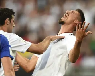  ?? ANDREAS GEBERT, THE ASSOCIATED PRESS ?? Germany’s Sandro Wagner celebrates one of his three goals in the World Cup qualifier between Germany and San Marino in Nuremberg, Germany, last weekend.