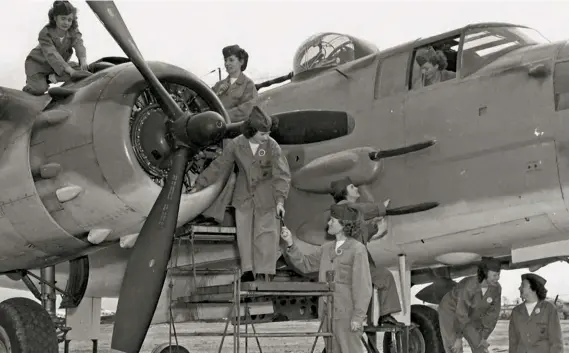  ??  ?? Below: WAVES (for Women Accepted for Volunteer Emergency Service), part of the Naval Reserve in WW II, ready a PBJ for flight. (Photo courtesy of SoCal Wing CAF)