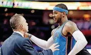  ?? OKLAHOMAN] [PHOTO BY NATE BILLINGS, THE ?? Carmelo Anthony, right, and Thunder coach Billy Donovan talk during a game against the Golden State Warriors at Chesapeake Energy Arena on Nov. 22, 2017.