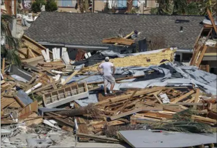  ?? CHRIS URSO — TAMPA BAY TIMES VIA AP ?? Jay Faulk, 56, surveys the damage to his home in Mexico Beach, Fla., on Friday.