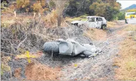  ?? PICTURE / SUPPLIED ?? Surroundin­g bush caught alight after the fatal crash between a car and motorcycle near Omanaia on Saturday.