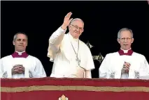  ?? PHOTO: GETTY IMAGES ?? Pope Francis delivers his Christmas Urbi et Orbi blessing from the central balcony of St Peter’s Basilica.