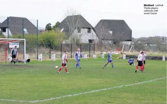  ??  ?? Mobbed Larkhall Thistle players celebrate with scorer Gracie