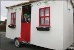  ??  ?? Kevin Doody Jnr. and Frank O’ Sullivan pictured in a replica of the Corner House Bar which was made by Kevin Doody Snr. for the Boherbue Parade.