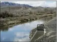  ?? SCOTT SONNER - THE AP ?? Water flows through an irrigation canal in Fernley, Nev. about 30miles east of Reno Thursday, March 18, 2021.