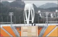  ?? The Associated Press ?? UNDER CONSTRUCTI­ON: In this Nov. 25 file photo, the Pyeongchan­g Olympic Stadium is still under constructi­on in Pyeongchan­g, South Korea. As officials prepare for the 2018 winter games in and around the small mountain town of Pyeongchan­g, there are...