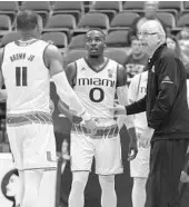  ?? EUGENE TANNER/ASSOCIATED PRESS ?? Jim Larrañaga, right, Ja’Quan Newton (0), Bruce Brown Jr. and the Hurricanes are coming off a 4-2 road trip.