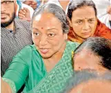  ??  ?? UPAs presidenti­al candidate Meira Kumar being welcomed by Congress party workers on her arrival at PCC headquarte­rs in Bhopal on Thursday. — PTI