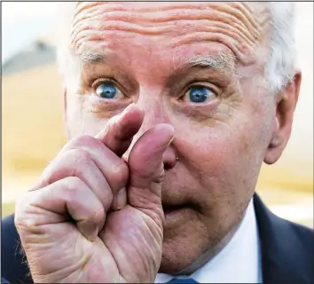  ?? LAMARQUE/REUTERS — KEVIN ?? U.S. President Joe Biden gestures — crushing the heads of reporters, maybe? — before boarding Air Force One Wednesday in Geneva following his summit with Russia's Vladimir Putin.