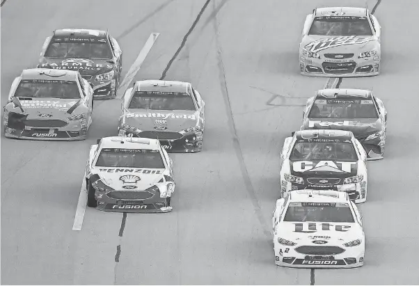  ??  ?? Brad Keselowski, front right, leads a pack of cars during the October race at Talladega Superspeed­way. JOHN DAVID MERCER/USA TODAY SPORTS