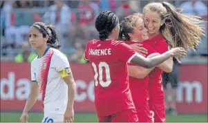  ?? CP PHOTO ?? Canada’s Jordyn Huitema (right) celebrates with Ashley Lawrence (10) and Jessie Fleming after scoring her second goal and her country’s sixth as Costa Rica’s Shirley Cruz walks by during second half Internatio­nal women’s soccer action in Toronto in this file photo from June 2017. Huitema is the captain of the Canadian side that opens the FIFA U-17 Women’s World Cup against Colombia today.