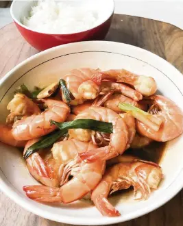  ?? KATE KRADER Bloomberg ?? Oil-Exploded Shrimp ‘sounds more aggressive than it is,’ says cookbook author Betty Liu.