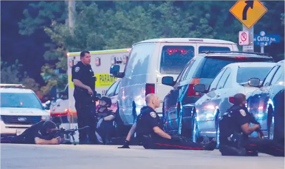  ?? PATRICK DOYLE ?? Dozens of police vehicles surround the south-end home where a shooting had been reported.